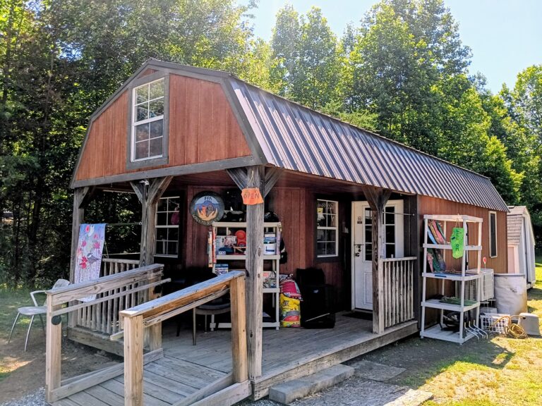The WAGS to Riches thrift store, a small wooden building with a front porch